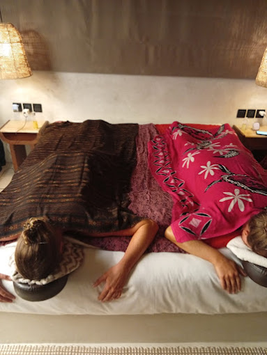 Clients relaxing together during massage session at Home spa and massage in Bali by Dewi Sri Home Spa